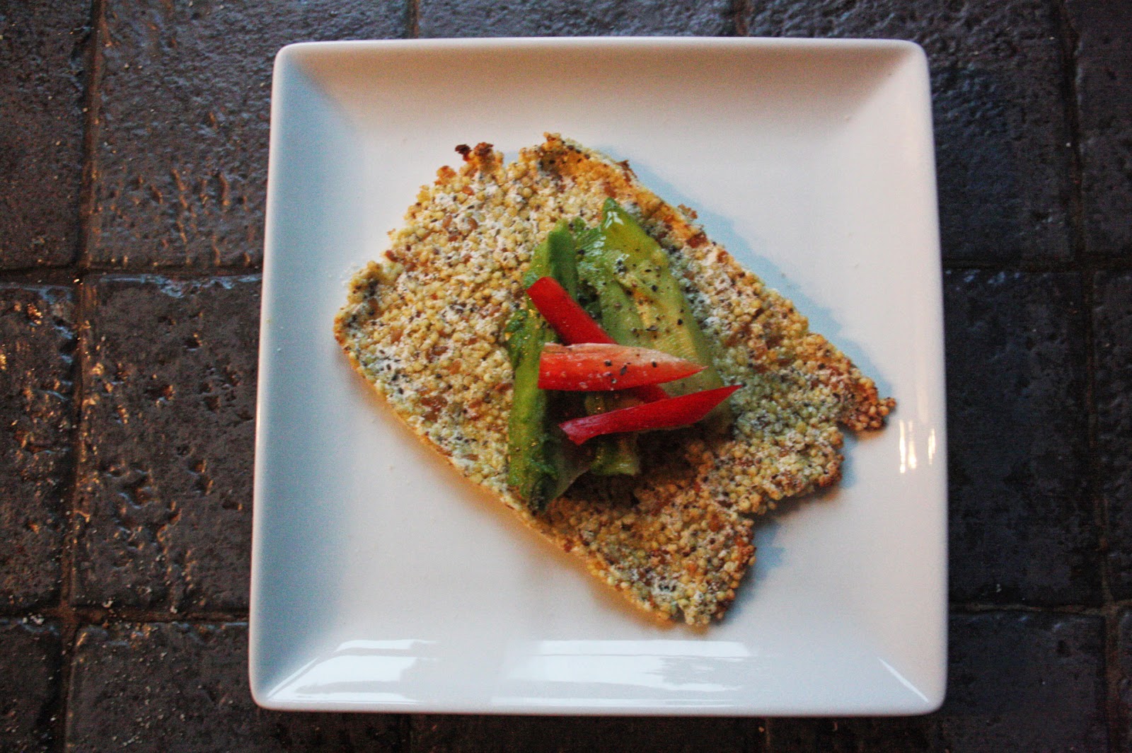 Quixotic Millet+seed crackers topped with avocado and peppers
