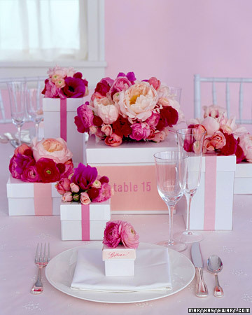 Wedding Table Decorations Boxes topped with flowers make a beautiful