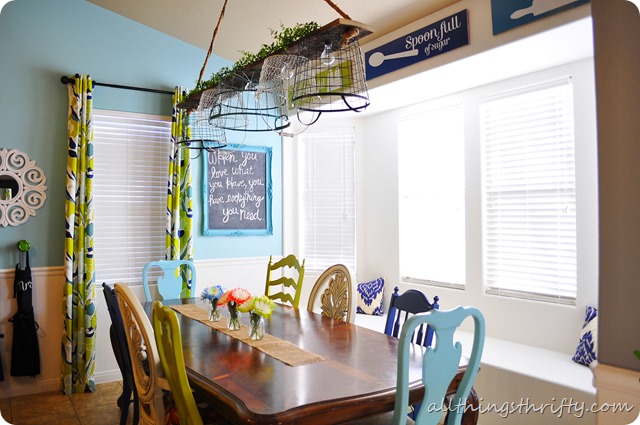 One cool chicken wire basket chandelier by All Things Thrifty, featured on I Love That Junk