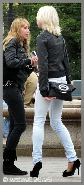 Girl walking in high heels on the street  