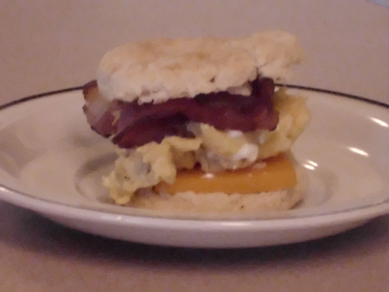 The Housewife Cooks Bacon, Egg, and Cheese Biscuits