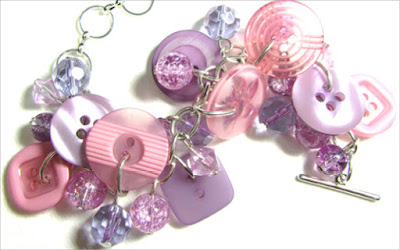 Big Bling Bracelet Bracelet has pink and purple buttons with crackle beads in pretty charm style design