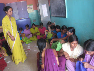 The Sewing Center is located at the Shekhwara Village School. This picture shows several women at the center.