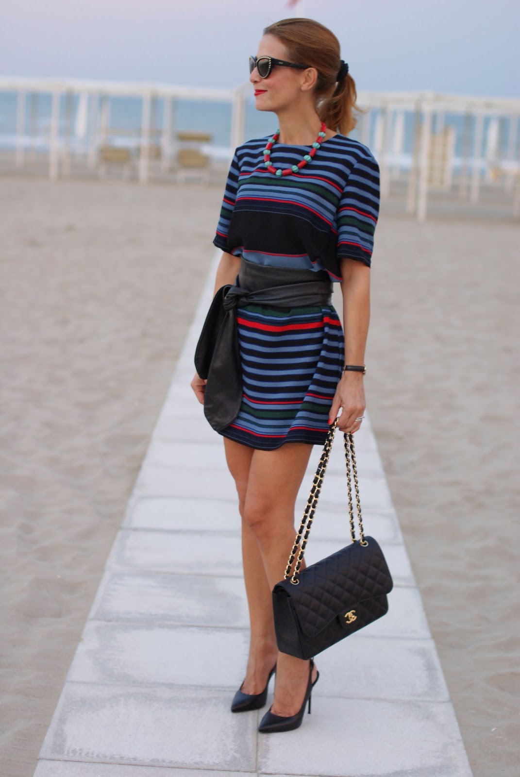 Blue motorbike jacket and striped dress with Chanel 2.55 bag on Fashion and Cookies fashion blog, fashion blogger style