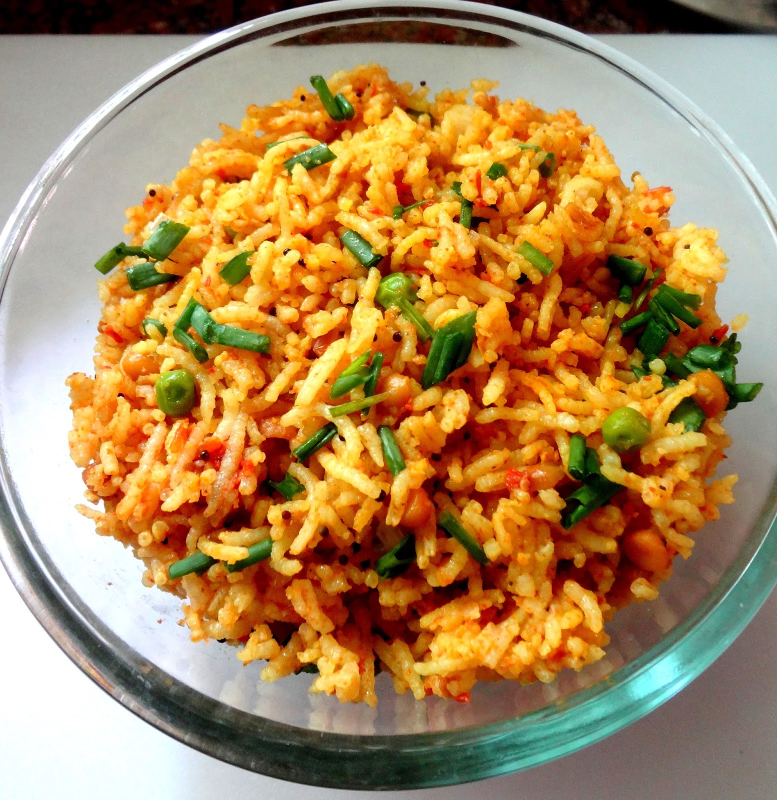 Tomato Rice with spring onions and green peas.