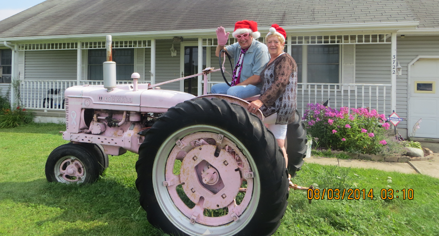 Sisaroo Archer and Dan Boyle on the Weird Pink Farmall in Austinburg Ohio.