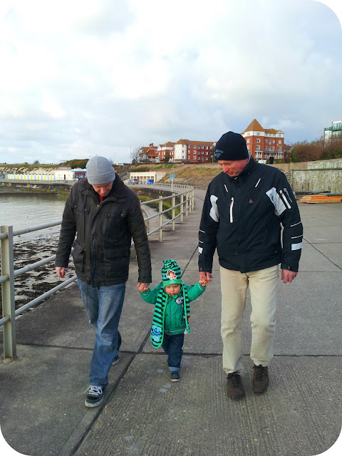three generations, father and son, grandfather and son, seaside walk