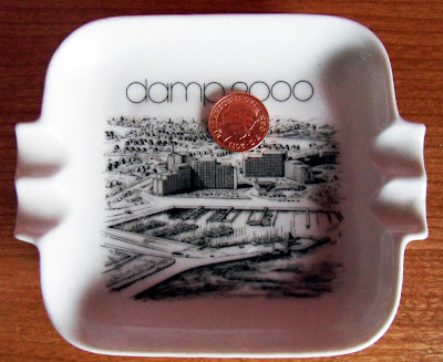 A British one penny coin in an ashtray