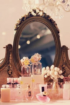 awesome pink perfume bottles on a dressing table