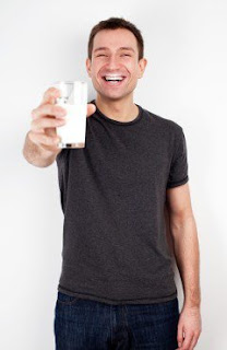 man holding kefir drink