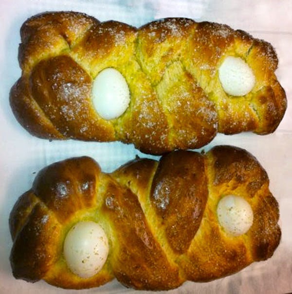 Tsoureki (Sweet Greek Easter Bread): A classic rich ans sweet bread from Greece that is traditionally used to break the lenten feast. Shown decorated with whole eggs for Easter,