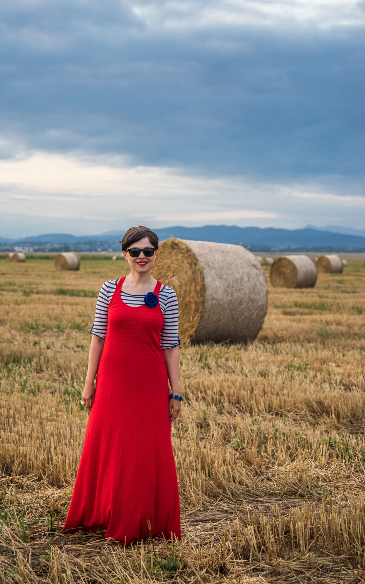 maxi red dress striped top stripes pimkie black flats cardigan hay bales photo shooting  black maxi bag brasov trip mountains 