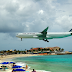 Low Fying Airplane In Maho Beach