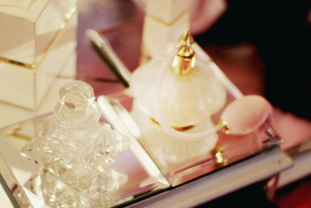 sparkling perfume bottles on a dressing table
