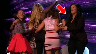 Did Lauren Murray push a member of 4th Impact as they try to hug her during The X Factor?