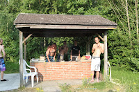 People eating from the BBQ