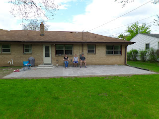 My wife, my brother, and myself sit on the completed patio
