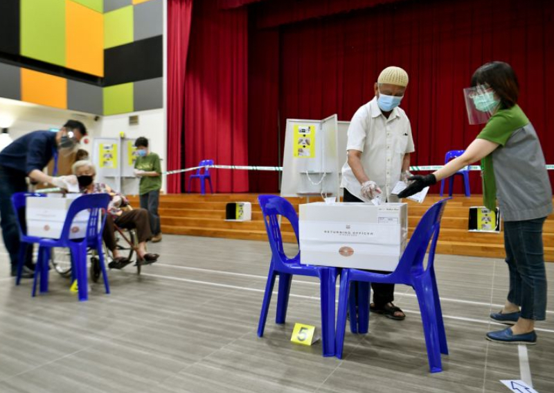 People casting their votes inside Teck Ghee Community Club, on July 10, 2020.