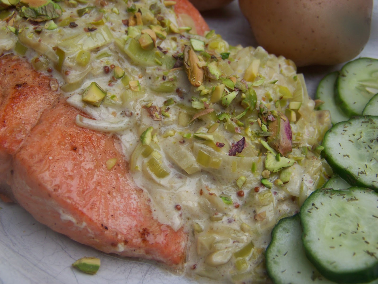 Tora's real food Salmon with leekmustard sauce and pistachio topping