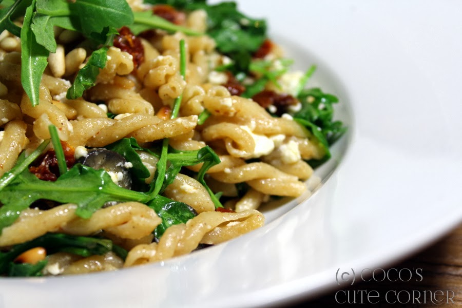 Pasta with sundried Tomatoes, Olives, Garlic, Pine Nuts and Rocket Salad