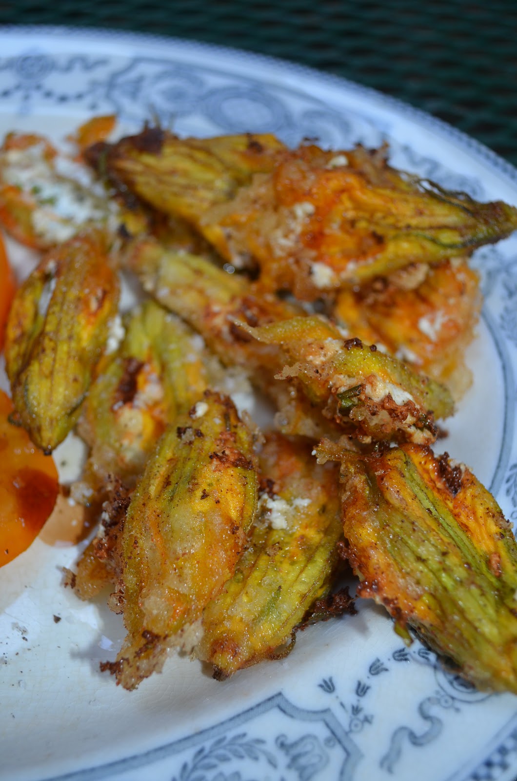 amour fou(d) ricotta stuffed zucchini blossoms + tomato salad.