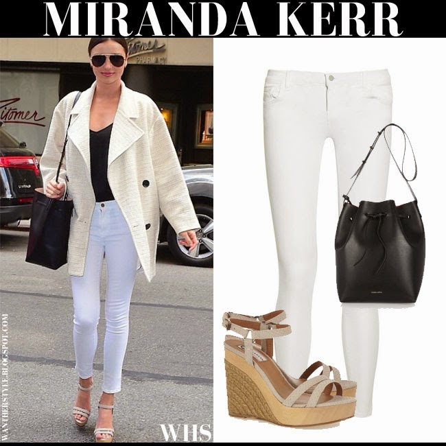 Miranda Kerr in cream coat with white J Brand skinny jeans and wedge