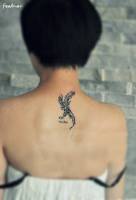 double feather tattoo on the back