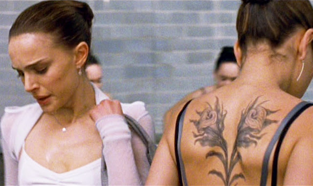  by Mila Kunis Lily's tattoo on her back a pair of calla lilies