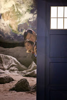 The Doctor and Clara peek out of the TARDIS