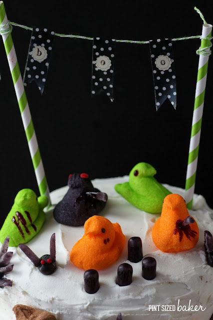 Zombie-fied Peeps on top of a Halloween Cake and Cupcakes. #Halloween #Fun #Peeps