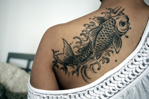 Some koi fish tattoo designs are also inked in orange and multicolors
