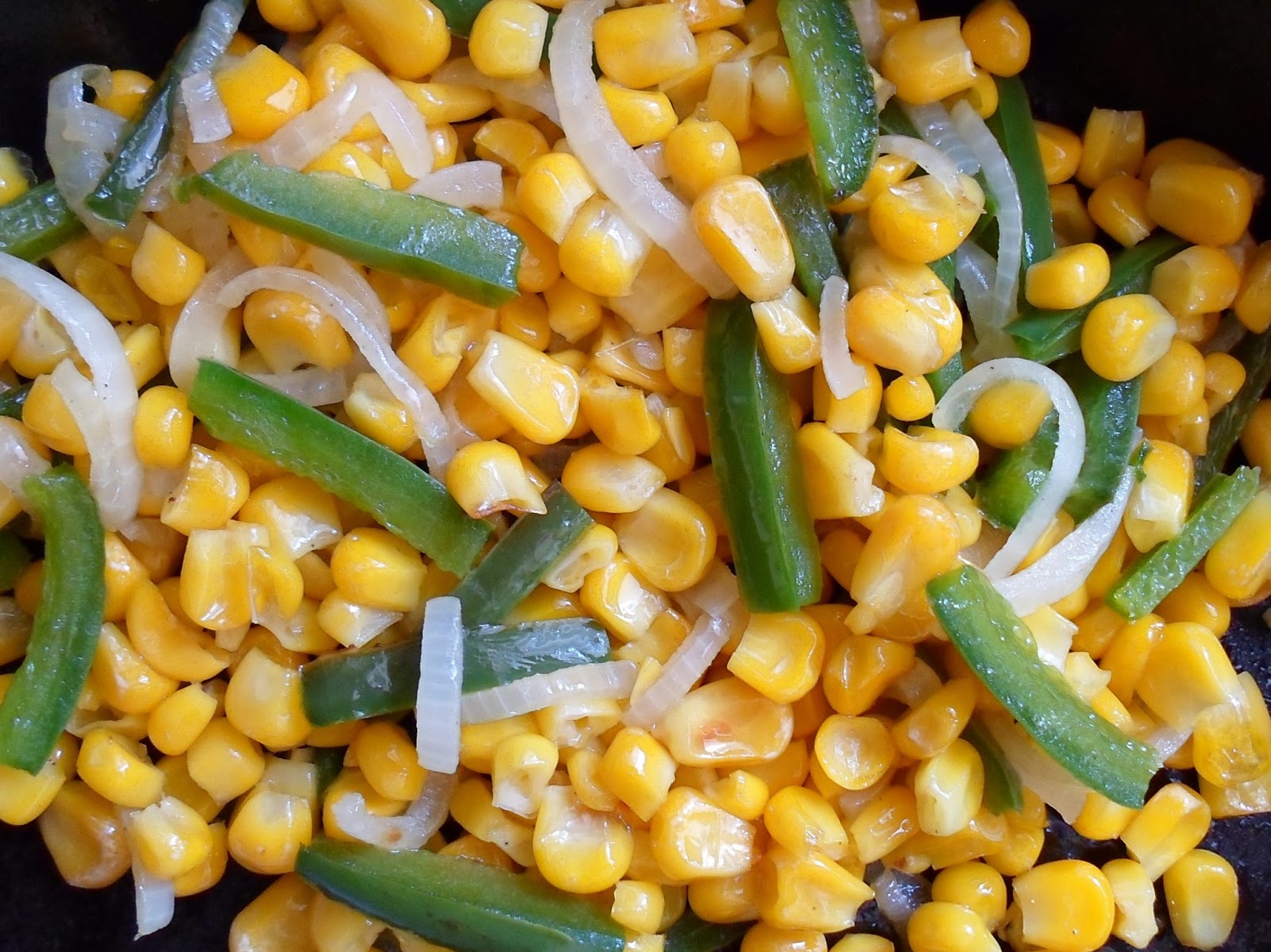 Happier Than A Pig In Mud Grilling Veggies in a Cast Iron SkilletCorn with Peppers and Onion