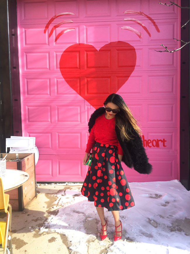 Feather Jacket, Red Sweater and Polka dot Midi Skirt