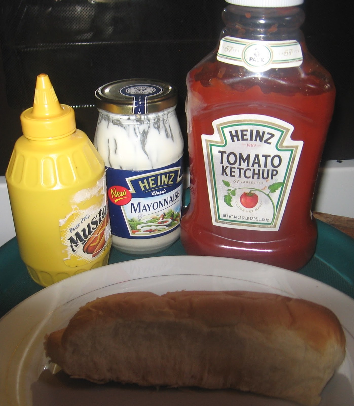 Naija Hotdog With Mayonnaise Mustard Ketchup And Green vegetables