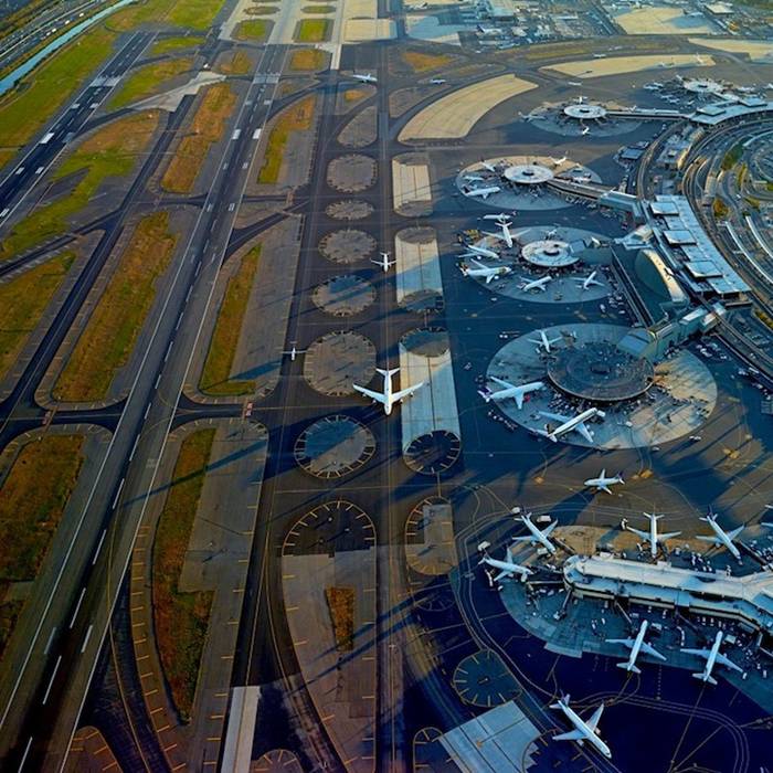 Jeffrey Milstein Aerial Shots of  International Airport, The series displays "the patterns, layering and complexity of cities, and the circulation patterns for travel, such as waterways, roads, and airports that grow organically over time much like a living organism." The interweaving roads and geometric presentation viewed in the collection is a unique sight to be seen from a bird's-eye view. While exhilarating to be moving in midair, the images exhibit the beautiful downtime and landing marks for airplanes.