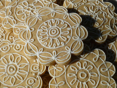 intricately decorated lemon-rosemary tea biscuits/cookies