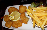 Posh Scampi and Chips (Monkfish) in breadcrumbs deep fried with French Fries, Peas and Tarture sauce.