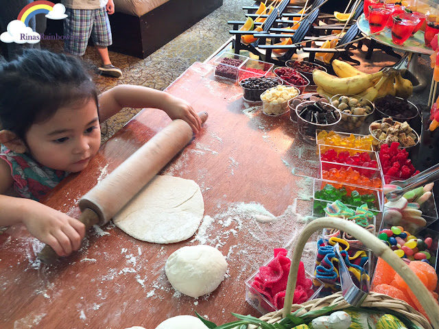 toddler rolling dough