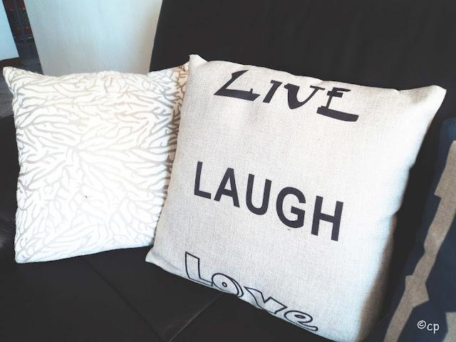 Close up of the Live Laugh Love cushion