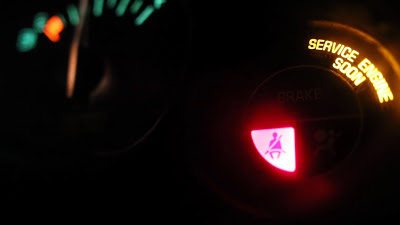 The seatbelt warning light on the dashboard of a car