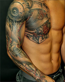 cyborg tattoo covering the chest, the shoulder and the arm