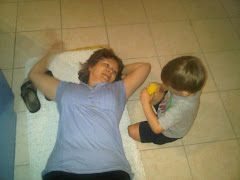 My nephew and I playing on the floor.