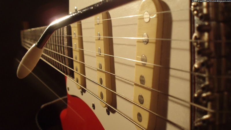 Guitar Wallpaper - Red Fender Stratocaster Electric Guitar Bridge title=