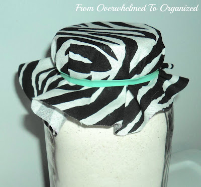 Attaching ribbon to jar.