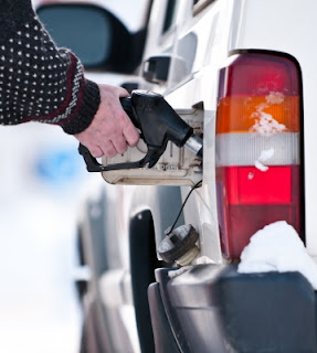 Image of person buy fuel at the pump