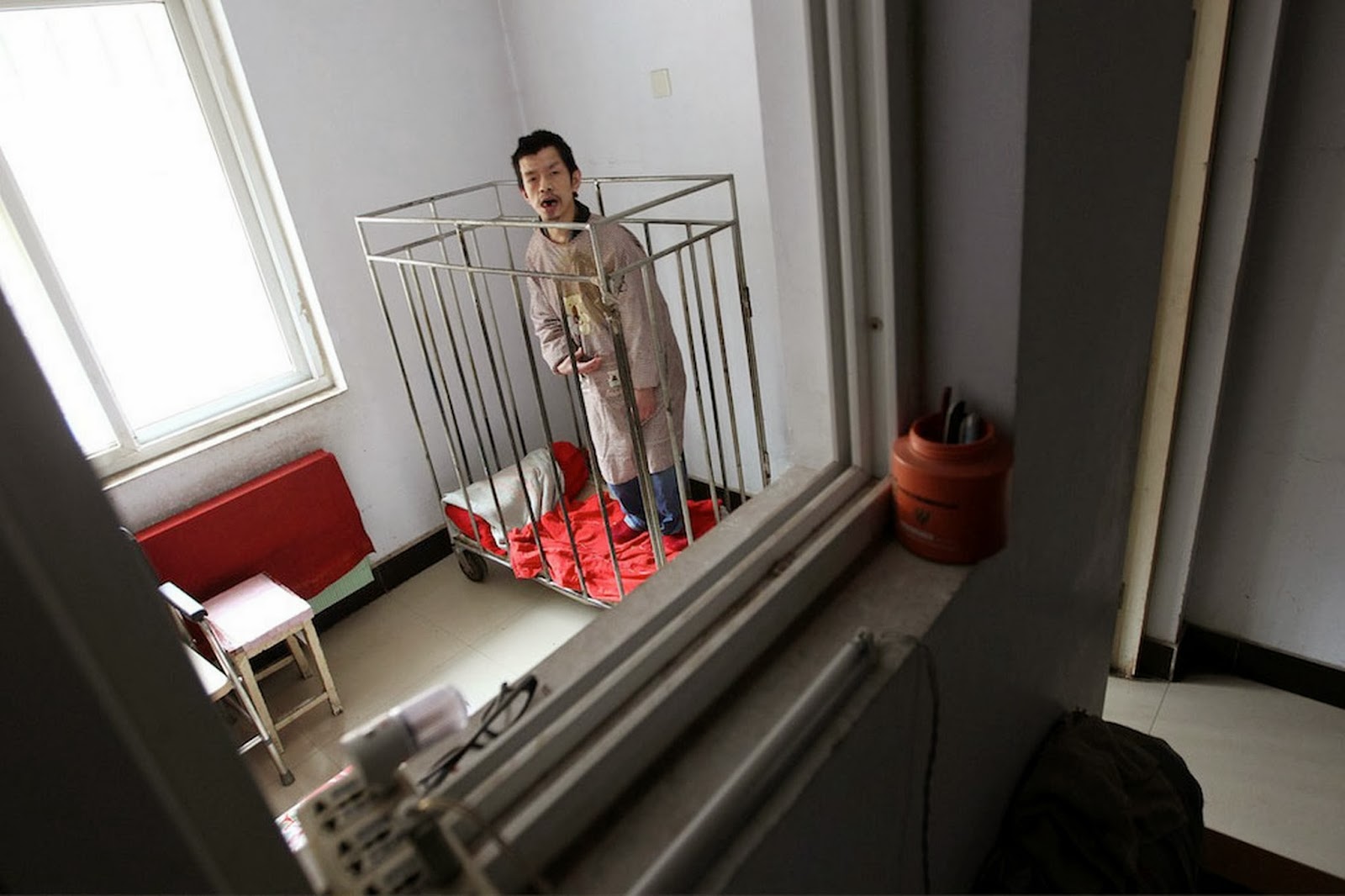Asian man in cage one year