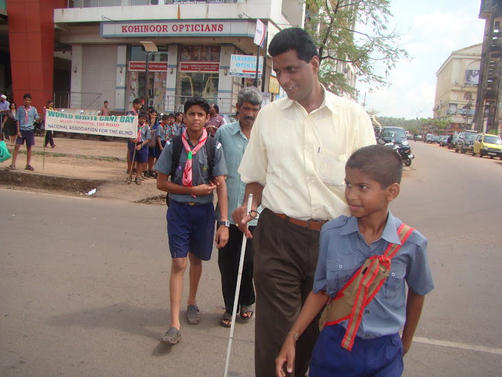 Assisting the blind to cross the road.