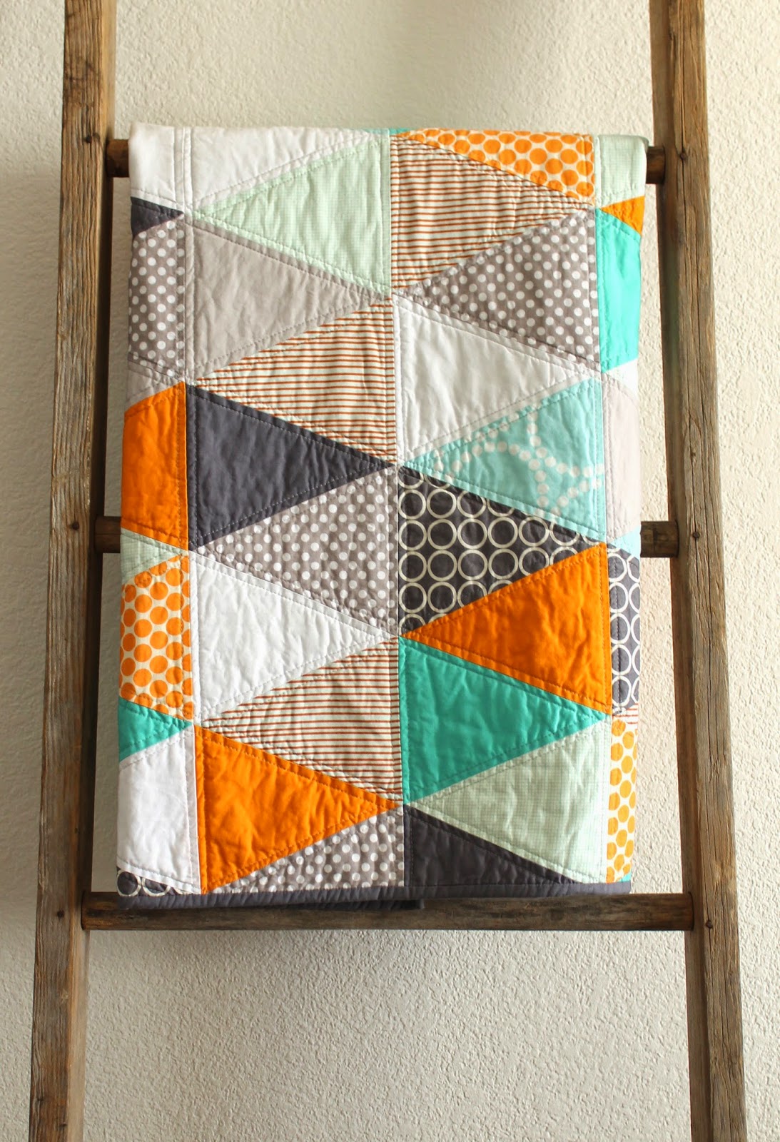 craftyblossom orange and aqua isosceles triangle quilt.