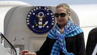 US Secretary of State Hillary Clinton steps out of an aircraft upon arrival at Paya Lebar Air Base in Singapore Nov 16, 2012