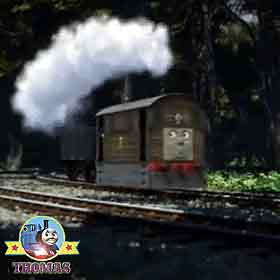 Toby the tank engine in the Whistling Woods railway track blocked with a fallen woodland pine tree